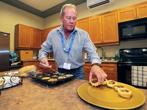 Volunteer Harry Campeau prepares food on Tuesday, Nov. 17, 2015, at The Hospice of Windsor and Essex County. The organization is seeking more volunteers, specifically men.