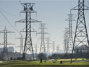 Hydro towers are seen over a golf course in Toronto on Wednesday, November 4, 2015.