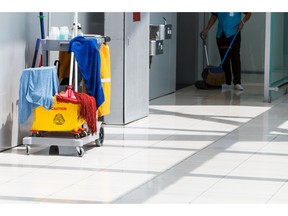 Janitorial worker and cleaning in process. Photo by fotolia.com.