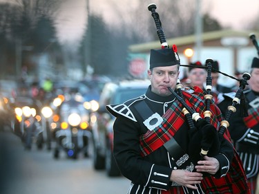 Pipers and drums lead a Highway of Heroes procession for John Gallagher in Blenheim, Ontario on November 20, 2015.  Gallagher was killed battling ISIS in Syria.  A procession travelled down the Highway of heroes from Toronto to Blenheim, Ontario.