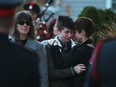 Family members  of John Gallagher cry as the Canadian soldier arrives in Blenheim, Ontario on Nov. 20, 2015.  Gallagher was killed battling ISIS in Syria.  A procession travelled down the Highway of heroes from Toronto to Blenheim, Ont.