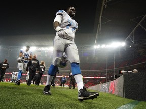 Cornelius Lucas #77 of Detroit Lions leaves the field following their 45-10 loss to the Kansas City Chiefs at Wembley Stadium on November 01, 2015 in London, England.