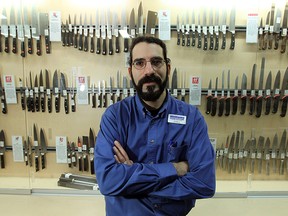 Joel Beneteau poses with the knife display at Williams Food Equipment in Windsor in January 2014. The store is again holding its knife sharpening fundraiser this month with proceeds going to the Salvation Army.