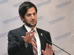 Adam Vasey, director of the Pathway to Potential organization speaks Tuesday, March 10, 2015, at the Caboto Club in Windsor, ON. during a "living wage" recognition event.