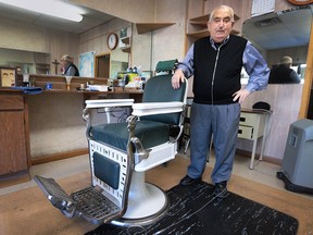 Mario Casoni, 78, is shown in his Wyandotte Street West barber shop on Wednesday, Nov. 25, 2015, in Windsor, Ont. He is retiring after almost 50 years of business at the Mayfair Barber shop.