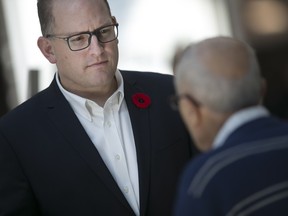 Windsor mayor Drew Dilkens speaks with resident, George Rapaich at a 20 year strategic vision event at Devonshire Mall, Saturday, Nov. 7, 2015.