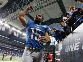 Golden Tate #15 of the Detroit Lions celebrates as he leaves the field after defeating the Oakland Raiders 18-13 at Ford Field on November 22, 2015 in Detroit, Michigan.