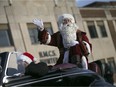 Santa waves to the children lining Ouellette Ave. during the Winter Fest Parade in downtown Windsor, Saturday, Nov. 28, 2015.