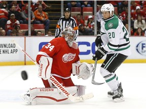 Detroit Red Wings goalie Petr Mrazek (34) defends Dallas Stars centre Cody Eakin (20) in the third period of an NHL hockey game, Sunday, Nov. 8, 2015 in Detroit.
