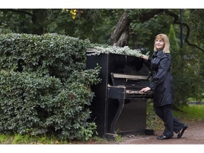 Playing the piano in an autumn park. Photo by fotolia.com.