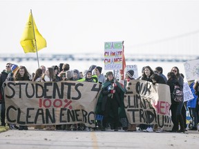 The Windsor People's Climate March walks along Windsor's riverfront, Sunday, Nov. 29, 2015.