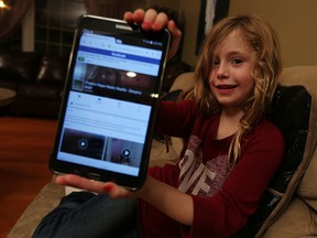 Devyn Nichols shows off the Facebook page she created with the hopes of helping the Syrian refugees, that will begin arriving shortly, at her home in Amherstburg on Monday, Nov. 23, 2015.