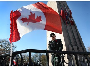 A sentinel stands guard at the cenotaph at the downtown Remembrance Day ceremony on Nov. 11, 2014, in Windsor.