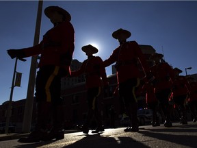 Members of the Royal Canadian Mounted Police march in the Remembrance Day parade before the start of a ceremony hosted by the Royal Canadian Legion and the HMCS Hunter at the Cenotaph in downtown Windsor, Sunday, Nov. 8, 2015.