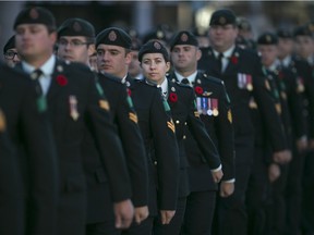 The Remembrance Day parade marches down University Ave. W in downtown Windsor, Sunday, Nov. 8, 2015.