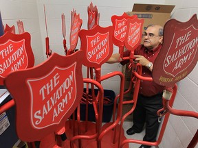 Joe Peterson, 2012 coordinator of the local Salvation Army Christmas kettle campaign sorts through some equipment at the Windsor, Ont. location.