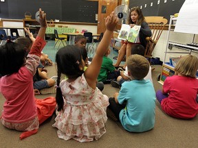 Nicola Dennis reads to her grade one class at Marlborough Public School in Windsor in this 2013 file photo.