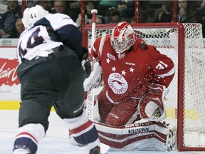 Sault Ste. Marie goaltender Brandon Halverson blocks a shot from Windsor's Luke Kirwan during OHL action Sunday, Nov. 15, 2015 at the WFCU Centre.