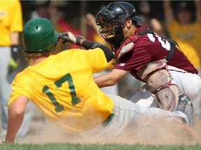 WINDSOR, ONT.:AUGUST 9, 2014 -- Curtis Rodrigues,  from the Sun Parlour Baseball Association, slides safely into home as the London District Baseball Association's Zach Kowalczyk is late with the tag during the Ontario Summer Games at Mic Mac Park, Saturday, August 9, 2014.  (DAX MELMER/The Windsor Star)