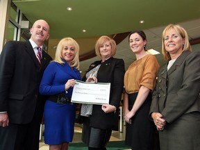 From left,  Eric Griggs,  District Vice President TD Canada Trust, June Muir, CEO Unemployed Help Centre and President of the Windsor Essex Food Bank Association, Karen Jean TD Canada Trust Branch Manager, Heidi Janzen, Unemployed Help Centre, and Barb Cole,  TD Canada Trust Branch Manager.   TD Canada Trust donated $2,000 to to the Windsor-Essex Food Bank Association to help families in need in the holiday season.