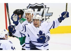 DALLAS, TX - NOVEMBER 10:  P.A. Parenteau #15 of the Toronto Maple Leafs celebrates his goal with Shawn Matthias #23 in the third period against the Dallas Stars at American Airlines Center on November 10, 2015 in Dallas, Texas.