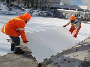 A City of Windsor crew removes the ice from Charles Clark Square in Windsor in February 2014.