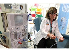 WINDSOR, ON. MARCH 12, 2015. -- Nurse Madeline Power demonstrates a dialysis machine during a World Kidney Day event at Windsor Regional Hospital Ouellette Campus in Windsor on Thursday, March 12, 2015.           (TYLER BROWNBRIDGE/The Windsor Star)