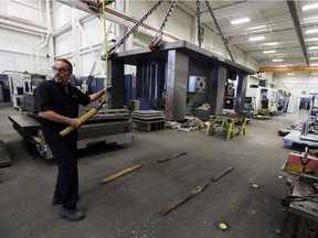 Mould makers work on various moulds at Cavalier Tool in Windsor on Monday, Nov. 16, 2015. The company is marking 40 years in business.