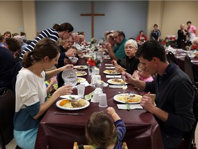 Close to 1,200 people enjoy a turkey dinner during the annual American Thanksgiving dinner at the Cottam United Church in Cottam on Thursday, Nov. 26, 2015. The church has been hosting the annual fundraiser for 70 years.