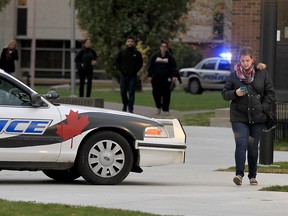 University of Windsor students and staff walk around Erie Hall during an incident where Windsor police investigated a threat Thursday November 12, 2015.