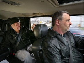 Windsor Star reporter Craig Pearson, left, gets a lift from an Uber driver Thursday, Nov. 12, 2015. It was the first day for the growing app-based ride-sharing service in the region.