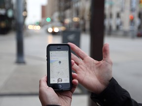 Windsor Star reporter Craig Pearson books a ride from Uber X on November 12, 2015 in Windsor, Ontario.   Uber started business in the region at 3:00 pm Thursday. (JASON KRYK/WINDSOR STAR)