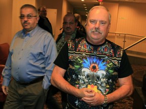 Mike Vachon, right, a truck driver, attended the Uber meeting at Holiday Inn on Huron Church Road Wednesday November 4, 2015.