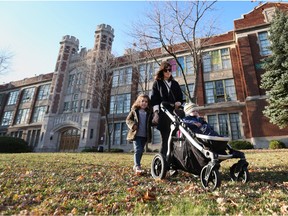File photo. Ontario parents should be given a greater choice in the types of schooling offered their children, say two Fraser Institute authors, Here, a mother and her children recently pass Windsor's Giles Campus French Immersion Public School on Giles Avenue.