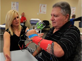 Stroke patient Jim Cecile, 66, receives neurological rehabilitation with Ann Marie Keough, a certified neurological physiotherapist at Enable Friday October 30, 2015.