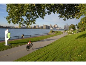 File photo of cyclist and walkers use the walkway along the Detroit River. (Windsor Star-Rob Gurdebeke)
