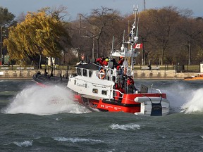 The Canadian Coast Guard Cape Dundas search and rescue lifeboat chops through the Detroit River on Thursday, November 19, 2015, on a blustery day.