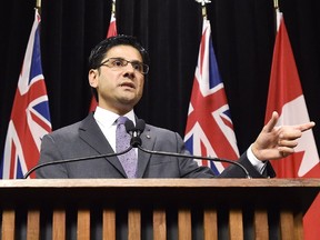 Yasir Naqvi, Ontario Minister of Community Safety and Correctional Services, explains a draft regulation for public input that would prohibit the random and arbitrary collection of identifying information by police, referred to as carding or street checks at Queen's Park in Toronto on Wednesday, October 28, 2015.