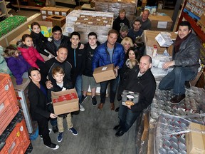 Unemployed Help Centre Food Bank received a generous donation of food items with a retail value of $32,000 from a co-operative of local businesses organized by Marc Romualdi and Fo Abiad, centre.  Skids of pasta and sauces, cereal, cookies, canned fish, pancake mix and dinner plates were delivered and unloaded Friday December 4, 2015. Supporters of the large donation were Matt and Christian Komsa of Bull and Barrel, City Grill and Level, supplier GFS,  Jim Cheetham of Tim Horton's, Paul DiGiovanni of Integrity Tool and Mold, Jerry Kavanaugh and Stephen Berrill of Architectural Design Associates, Dave Cecchin of Omega Tool Corp., Marco Dolfi of Miller Canfield, Jason Campbell of Sterling Financial and Jonathon Rodzik Jr.