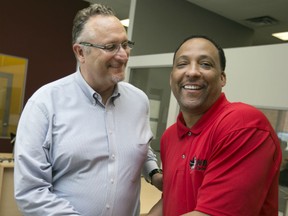 The new NBL of Canada commissioner, David Magley, is greeted by new Windsor Express head coach, Tony Jones, Wednesday, July 15, 2015. (DAX MELMER/The Windsor Star)