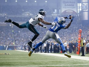 Detroit Lions wide receiver Calvin Johnson (81), defended by Philadelphia Eagles cornerback Eric Rowe (32) catches a pass for a touchdown during the second half of an NFL football game, Thursday, Nov. 26, 2015, in Detroit. (AP Photo/Rick Osentoski)