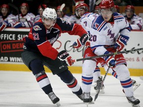 Windsor Spitfires Logan Brown and Kitchener Rangers Nick Magyar in OHL action from WFCU Centre February 11, 2015. (NICK BRANCACCIO/The Windsor Star)