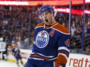 Edmonton forward Taylor Hall (4) celebrates a goal on  Dallas goaltender Antti Niemi (31) during the first period of a NHL game between the Edmonton Oilers and the Dallas Stars at Rexall Place in Edmonton, Alta. on Friday December 4, 2015. Ian Kucerak/Edmonton Sun/Postmedia Network