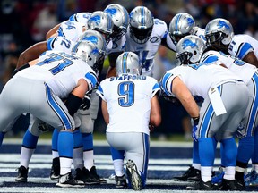 The Detroit Lions huddles around Matthew Stafford #9 in the second quarter against the St. Louis Rams at the Edward Jones Dome on December 13, 2015 in St. Louis, Missouri. (Photo by Dilip Vishwanat/Getty Images)