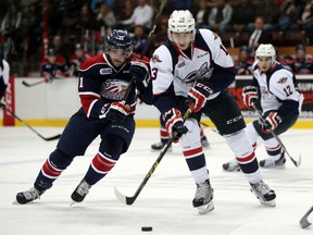 Saginaw Spirit centre Kris Bennett chases down Windsor Spitfires Gabriel Vilardi during third period Ontario Hockey League action at the WFCU Centre on October 1, 2015. (JASON KRYK/The Windsor Star)