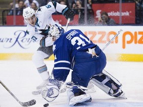 Toronto Maple Leafs' goalie Garret Sparks (31) makes a save against San Jose Sharks' centre Tommy Wingels (57) during first period NHL hockey action, in Toronto, on Thursday, Dec. 17, 2015. THE CANADIAN PRESS/Nathan Denette