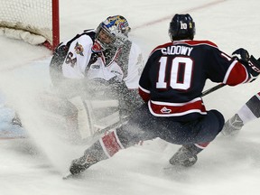 The Windsor Spitfires Michael DiPietro gets a face full of snow from the Saginaw Spirits Dylan Sadowy at the WFCU Centre in Windsor on Thursday, December 17, 2015.               (TYLER BROWNBRIDGE/The Windsor Star)
