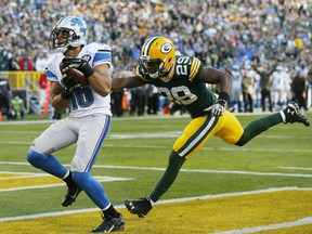 Detroit Lions' Lance Moore catches a touchdown pass in front of Green Bay Packers' Casey Hayward during an NFL football game in Green Bay, Wis. (AP Photo/Mike Roemer, File)