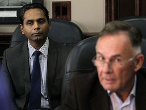 Rakesh Naidu, interm CEO, listens in as a $2.3 million surplus on the WindsorEssex Economic Development Corporation books is discussed during a press conference at city hall in Windsor on Wednesday, December 2, 2015. The WindsorEssex Economic Development Corporation will return $1.7 million dollars to the city and the county after occurring the surplus over several years. The corporation will retain a $600,000 contingency fund.