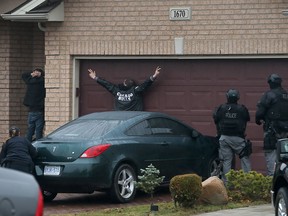 Windsor Police Emergency Service Unit, uniformed officers and OPP Repeat Offenders ROPE units all converged at 1670 Clover Ave. in East Riverside to make arrests on outstanding warrants and other possible offences Tuesday December 01, 2015. (NICK BRANCACCIO/Windsor Star)